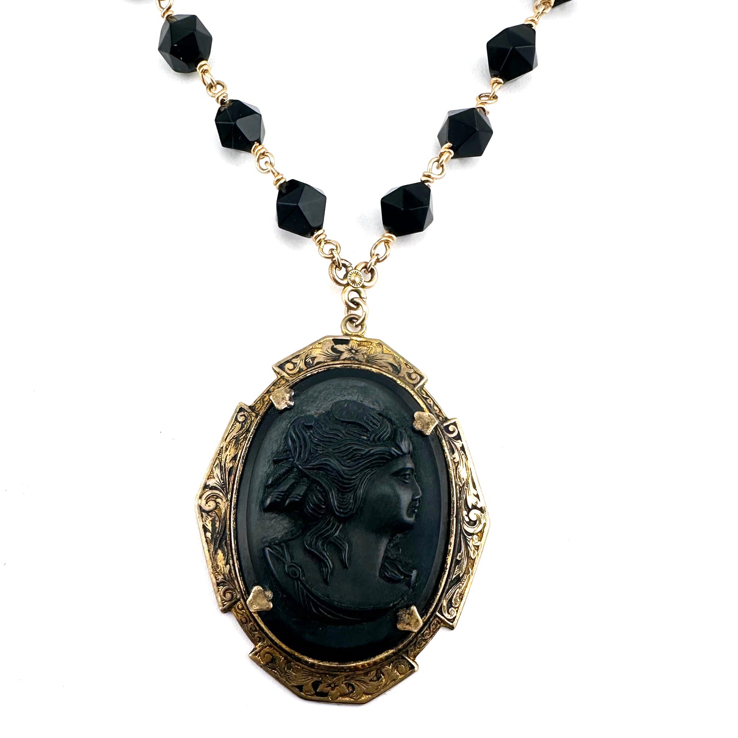 
                  
                    Antique Black Cameo with Star Cut Onyx
                  
                